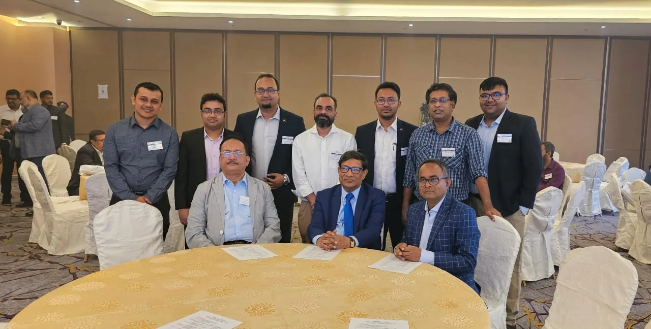 Dr. Arefin with surgeons group at conference table 2024