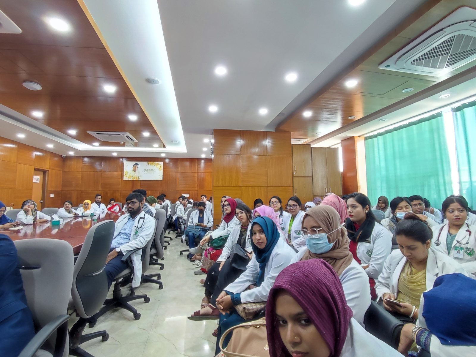 Medical trainees attending a session on surgical decision making training in a conference room setting.